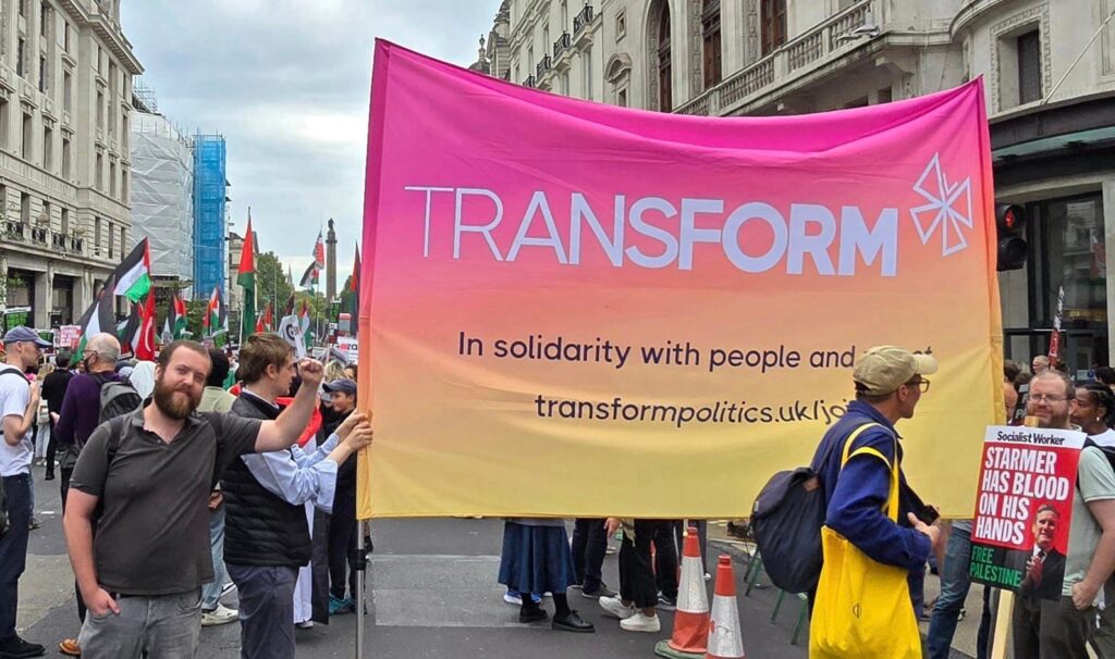 A march with the Transform banner